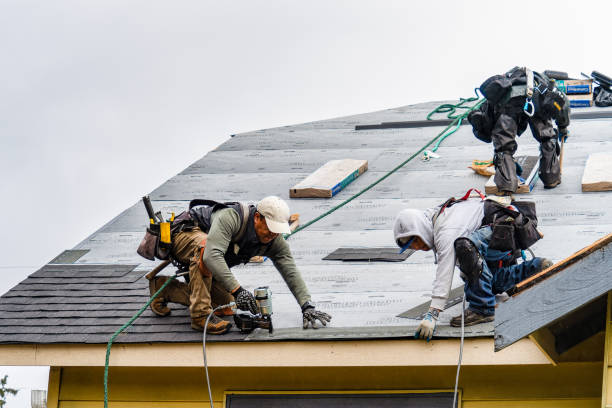 Professional Roofing technician working in Dover, MA